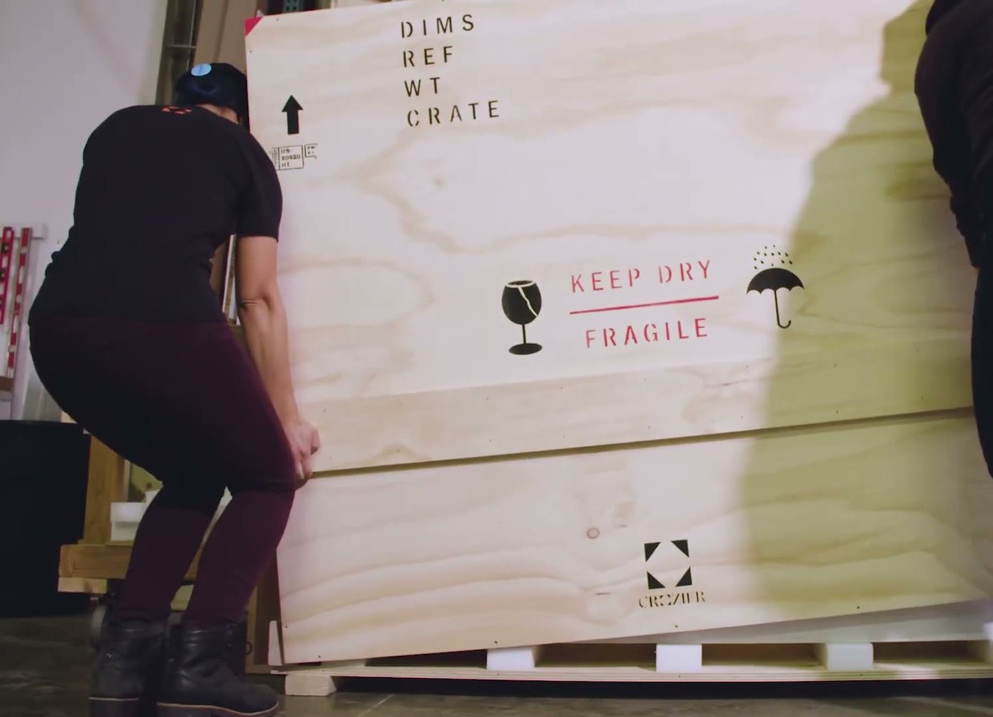 1 Man 1 Van crew lifting a large crate on a job in Orlando